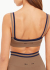THE UPSIDE women’s mocha recycled Form Seamless Kelsey Bra is a double-layer mocha bra with navy contrast and moisture control. Made for yoga and pilates.