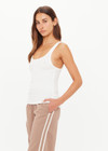 THE UPSIDE women’s white Alyssa Racerback Tank Top features rib fabric, a scoop neck, and embroidered 4-leaf clover at the back. Made for everyday leisure.