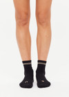 THE UPSIDE women's black Celestia Grip Sock is an anti slip grip sock perfect for pilates & yoga. Featuring a soft terry sole and embroidered lucky horseshoe & star.