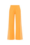THE UPSIDE women’s lightweight yellow Juliet Pant features a low-rise fit with contrast binds and split hem detail. Perfect for travel and everyday wear.