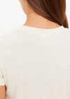 THE UPSIDE women's creme organic cotton The 70's Tee features a rib neckline and classic 70s-inspired style. Made for everyday wear.