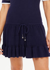 THE UPSIDE women's navy tennis Plume Knit Collared Dress fits true-to-size and features a drop waist with gathered skirt and a drawcord with tennis charms.