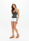 THE UPSIDE women's cream Molokai Lee Crochet Short is fitted with a contrast green elastic waistband and hem, featuring green and cream Yin Yang patch at back. Made for lifestyle.