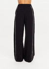 THE UPSIDE women's black Haveli Wide Leg Pant is true to size with a structured waistband, fly zipper, belt loops, and cream embroidered side seams. Made for lifestyle.