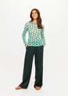 THE UPSIDE women's green Latania Ada Long Sleeve Knit is regular fit with a geometric print and striped knitted rib neckline. Made for lifestyle.