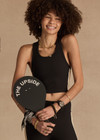 THE UPSIDE women's black Arcadia Sophie Crop Top is supportive and comfortable with a racerback longline design, internal shelf bra, and removable cups. Made for yoga & pilates.