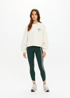 THE UPSIDE women's natural Molokai Paloma Crew is boxy fit with an embroidered green palm tree logo at front chest. Made for lifestyle.