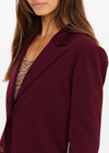 THE UPSIDE women's maroon Mendoza Boyfriend Blazer is designed as a boyfriend style single breasted blazer with cream piping along side seams, tortoiseshell buttons and front welt pockets.