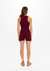 THE UPSIDE women's maroon organic cotton Simi Knitted Playsuit is fitted with a low V-neck and button-up closure with antique brass buttons. Made for lifestyle.