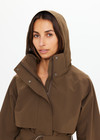 THE UPSIDE women's green James hooded trench coat features recycled waterproof polyester, a true-to-size fit and adjustable waist belt. Made for lifestyle.