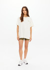 THE UPSIDE women's natural organic cotton Isadora Sammi Tee is designed for an oversized fit and features a printed logo in lime and blue with a soft rib neckline. Made for lifestyle.