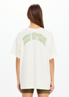 THE UPSIDE women's natural organic cotton Isadora Sammi Tee is designed for an oversized fit and features a printed logo in lime and blue with a soft rib neckline. Made for lifestyle.