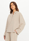THE UPSIDE women's khaki recycled cotton Soho Rhea Collared Top is designed for a relaxed fit and features a collar at neck with front button opening. Made for lifestyle.