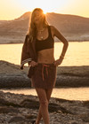 THE UPSIDE women's leopard organic cotton Malawi Karly Knit Mini Skirt offers a relaxed fit, featuring an elasticated waistband with orange drawcord and knitted stripes down sides. Made for lifestyle.