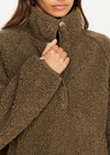 THE UPSIDE women's green recycled polyester Harlow Fleece Pullover is designed for a relaxed fit and features a quarter snap button opening and zip pockets. Made for lifestyle.