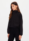 THE UPSIDE women's black Ace Shell Jacket is a water-resistant cropped zip-through jacket and features front pockets and an adjustable drawcord at waist. Made for running.