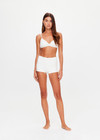 THE UPSIDE women's white Palais Rib Capri Bra is designed to be worn under sheer garments and features a v neckline with adjustable straps in a soft ribbed fabrication. Made for lifestyle.