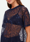 THE UPSIDE women's navy Memento Lace Sammi Tee is designed to be sheer, oversized and can be paired with the Capri Bra for coverage. Made for lifestyle.