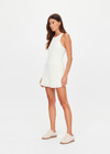 THE UPSIDE women's cream Lyon Pia Racerback Dress is a fitted stretch lace tennis dress with a high neck, A-line skirt and internal bodysuit with inner shorts and pockets. Made for tennis, golf & pickleball.