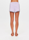 THE UPSIDE women's lilac organic cotton Amara Roller Knit Short is a relaxed fit featuring an elasticated waistband with drawcord and an open knit heart design down sides. Made for tennis, golf & pickleball.