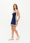 THE UPSIDE women's navy organic cotton blend Lori Knit Mini Dress features a scoop neckline with cream and lilac panels down sides and at hem. Made for tennis, golf & pickleball.