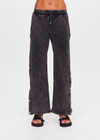 THE UPSIDE women's washed black Cosmic Wide Leg Shana Pant is a high waisted, wide-leg fit and features silver metal button snaps down leg that can be worn open.