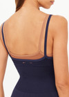 THE UPSIDE women's navy Form Seamless Jamie Bodysuit is firm and suportive and features a scooped neckline with a double layer bra with contrast tan underlayer. Made for pilates and yoga.