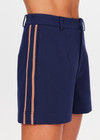 THE UPSIDE women's navy Toledo Leon Bermuda Short is a longerline tailored short featuring tan knitted tape down sides, flat waistband with belt loops and side pockets. Made for lifestyle.
