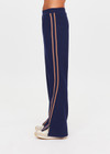 THE UPSIDE women's navy Toledo Petra Flare Pant features tan knitted tape down sides, an elasticated waistband, side pockets and splits at hem. Made for everyday wear.