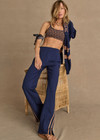 THE UPSIDE women's navy Toledo Petra Flare Pant features tan knitted tape down sides, an elasticated waistband, side pockets and splits at hem. Made for everyday wear.