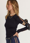 THE UPSIDE women's black Merino Wool Long Sleeve Top is designed for a slim fit and features a crew neck with mocha stripe down sleeve. Made for lifestyle.