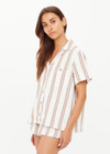 THE UPSIDE women's mocha stripe organic cotton Baja Katia Collared Shirt offers a relaxed fit and features a collar, patch pockets and wooden coconut buttons. Made for lifestyle.