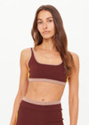 THE UPSIDE women's brown Montage Rory Scoop Knit Sports Bra features a scooped neckline with mid coverage and yellow side pannels. Made for yoga & pilates.