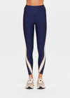 THE UPSIDE women's navy eco tech Toscan 25inch High Legging features a high-rise, breathable design with contrast mocha and cream binds along side seam. Made for yoga & pilates.