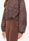 THE UPSIDE women's leopard recycled Ludlow Ace Shell Jacket offers a water resistant, cropped design with front pocket, elasticated cuffs and an orange drawcord at waist. Made for running.