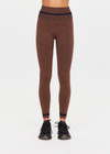 THE UPSIDE women's brown seamless Marle Seamless 25Inch Midi Legging offers a mid-rise with a black stripe at waistband. Made for yoga & pilates.