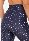 THE UPSIDE women's blue Bellaire 25Inch Legging features a cream star print with a mid rise design, tan striped drawcord and a supersoft recycled fabrication. Made for yoga & pilates.