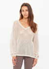 THE UPSIDE women's creme organic cotton Josephine V Neck Knit features a lightweight relaxed shape with a deep V neckline and mini ribbed hem, neckline and cuffs. Made for lifestyle.