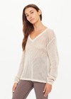 THE UPSIDE women's creme organic cotton Josephine V Neck Knit features a lightweight relaxed shape with a deep V neckline and mini ribbed hem, neckline and cuffs. Made for lifestyle.