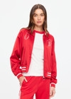 THE UPSIDE women's red 100% silk Two Hearts Silk Bomber Jacket is fully lined with cream and red stripes, welt pockets with triangle detail at top and bottom and an embroidered horse and horseshoe design. Made for lifestyle.