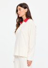 THE UPSIDE women's cream cotton Noosa Calling Collared Top is a relaxed long sleeve top in a soft brushed recycled fabrication with contrast red at the neck. Made for lifestyle.