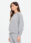 THE UPSIDE women's grey cotton Hit The Road Track Top is a relaxed raglan crew neck sweater in french terry fabrication with a ribbed neckline, arms and cuffs. Made for lifestyle.