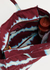 THE UPSIDE women’s tie dye organic cotton Rio Quilted Tote Bag has external and internal pockets, a waterbottle holder, and slips easily on suitcase. Made for lifestyle.