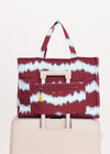 THE UPSIDE women’s tie dye organic cotton Rio Quilted Tote Bag has external and internal pockets, a waterbottle holder, and slips easily on suitcase. Made for lifestyle.