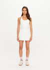 THE UPSIDE women’s cream recycled Kova Racerback Dress has built in shorts with pockets, a scooped front neckline with a racerback bra. Made for tennis.
