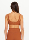 THE UPSIDE women’s brown recycled jacquard Mariana Bridie Sports Bra is designed for a soft, supportive fit and features removable cups and textured fabrication. Made for yoga and pilates.
