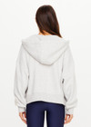 THE UPSIDE women’s grey marle organic cotton Jude Crop Hoodie offers an oversized fit and features a zip through front, hood with drawcord and ribbed cuffs and hem. Made for lifestyle.