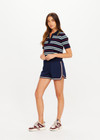 THE UPSIDE women’s stripe 100% organic cotton Archie Collared Knit Polo is true to size and features a striped rib collar, button front closure and ribbed hem. Made for tennis.