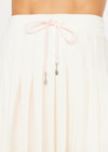THE UPSIDE women’s cream recycled Cadiz Pleated Skirt is designed for a true to size fit and features a pleated design, built in inner short with pockets and drawcord detail. Made for tennis.