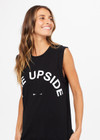 THE UPSIDE women's black Muscle Tank is made of organic cotton jersey. It features low-cut arm openings, rolled bind detail at the sleeve and a white horsehoe logo at the centre front.